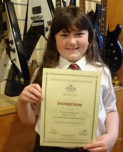 Sophie Passes with Distinction Registry of Guitar Tutors